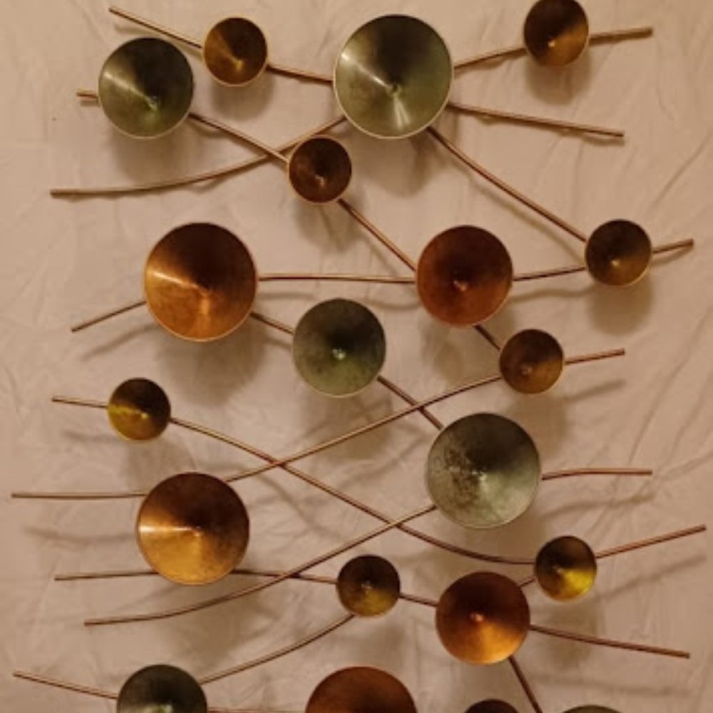 circle metal wall art 50in by 32 1/2in